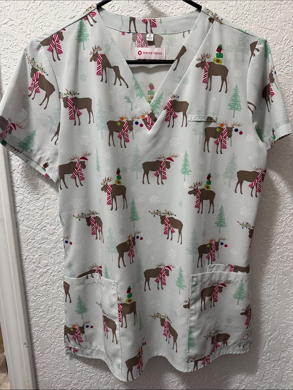 White Cross Women’s Scrub Top - Mint with Brown Reindeer and Red Accents